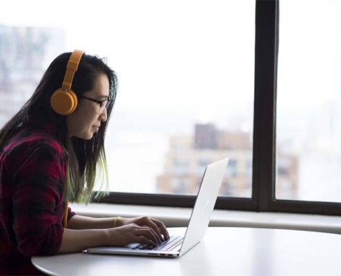 Woman working on a laptop, CampusCE Blog, Digital transformation made easy