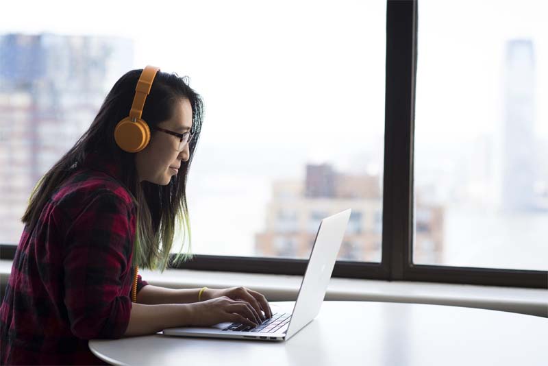 Woman working on a laptop, CampusCE Blog, Digital transformation made easy